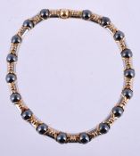 A steel, hematite and gold coloured collar necklace by Bulgari