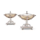 A pair of French silver parcel gilt navette pedestal sauce tureens and covers by Sébastien Dupezard