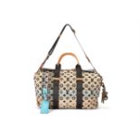 Louis Vuitton, Collection Printemps Eté 2010, Cheche Tuareg, a Monogram bag