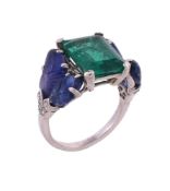 An emerald and carved sapphire ring