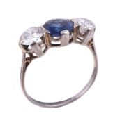 A sapphire and diamond three stone ring