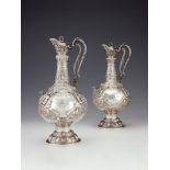 A pair of Victorian Irish silver Armada pattern claret jugs by John Smyth