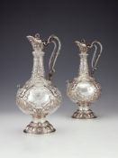 A pair of Victorian Irish silver Armada pattern claret jugs by John Smyth