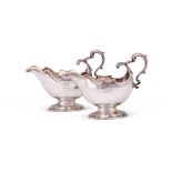 A pair of George II silver oval pedestal sauce boats by George Methuen