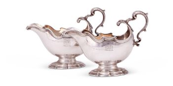 A pair of George II silver oval pedestal sauce boats by George Methuen