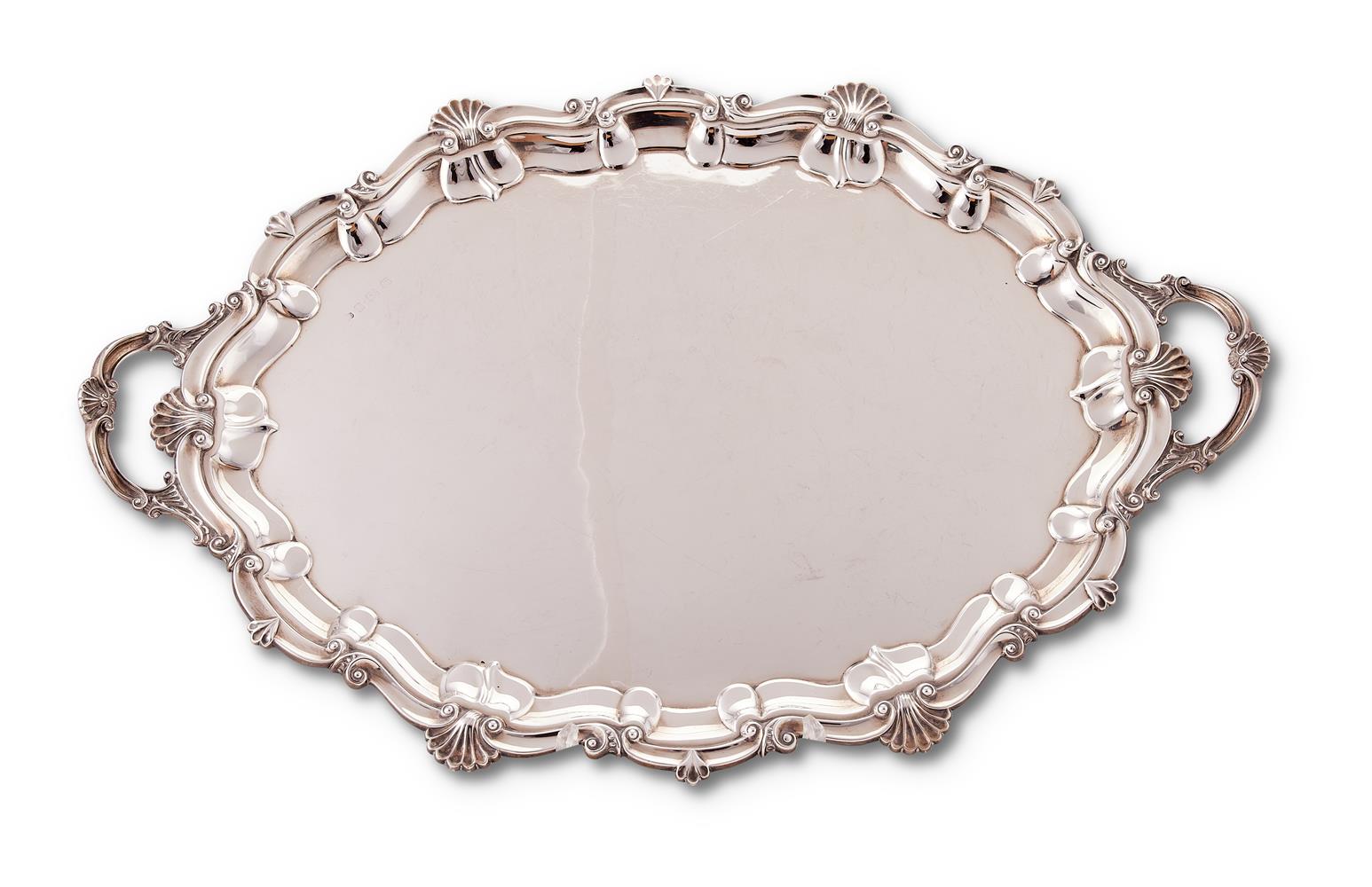 A large silver shaped oval twin handled tray by Elkington & Co.