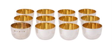 A set of twelve silver plain tumbler cups by William & Son (William Rolls Asprey)