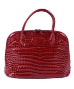 Y William & Son, Bugatti, a chilli red large crocodile handbag