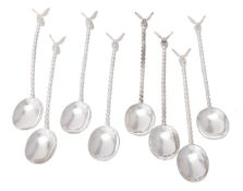 Eight silver honey spoons by William & Son (William Rolls Asprey)