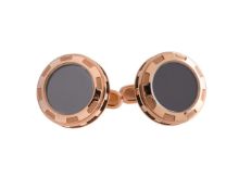 A pair of hematite and resin cufflinks by William & Son