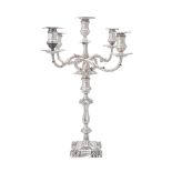 AN EDWARDIAN SILVER SHAPED SQUARE FIVE-LIGHT CANDELABRUM BY MARTIN, HALL & CO.