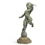 A LEAD AND COMPOSITION GARDEN FIGURE OF A CUPID