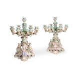 A PAIR OF CONTINENTAL PORCELAIN SEVEN LIGHT CANDELABRA