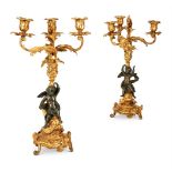 A PAIR OF FRENCH GILT AND PATINATED BRONZE CANDELABRA