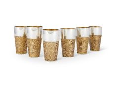 A SET OF SIX SILVER PARCEL GILT TAPERED BEAKERS BY STUART DEVLIN