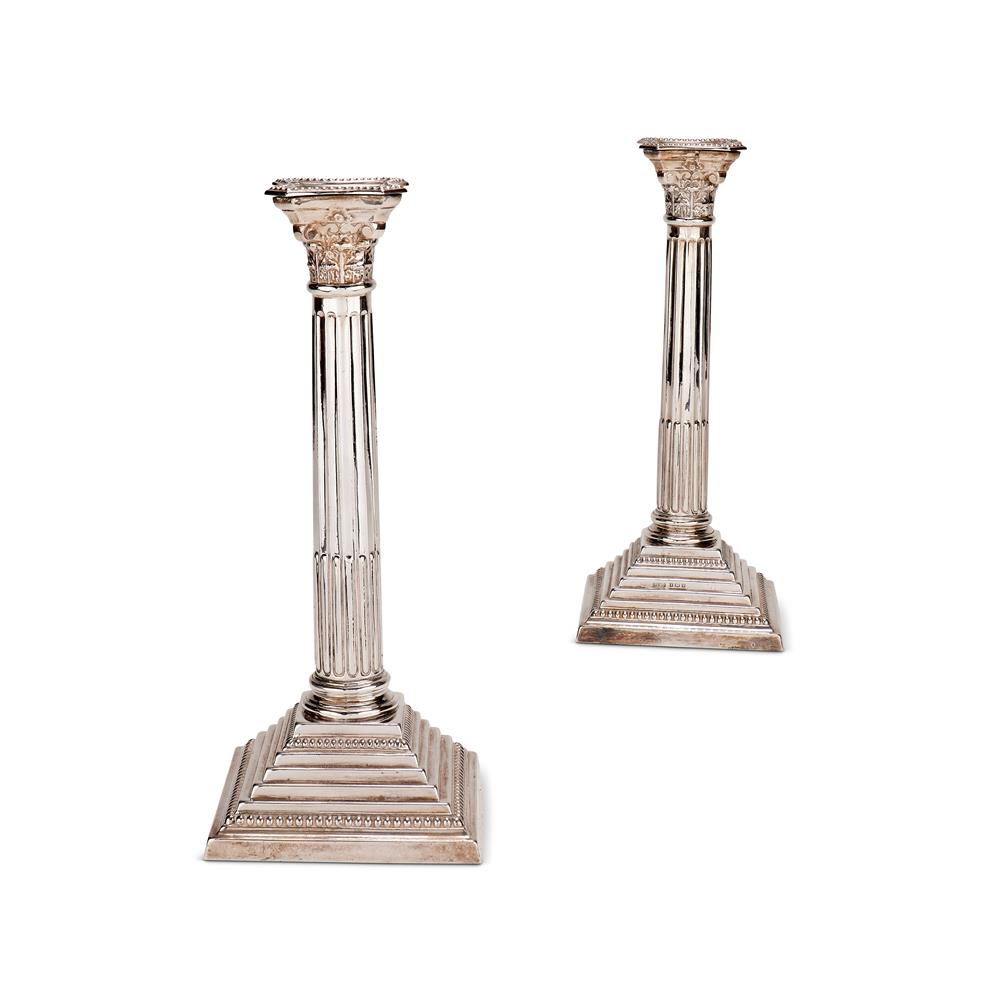 A PAIR OF SILVER CORINTHIAN COLUMN CANDLESTICKS