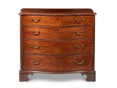 A GEORGE III MAHOGANY SERPENTINE COMMODE, IN THE MANNER OF THOMAS CHIPPENDALE