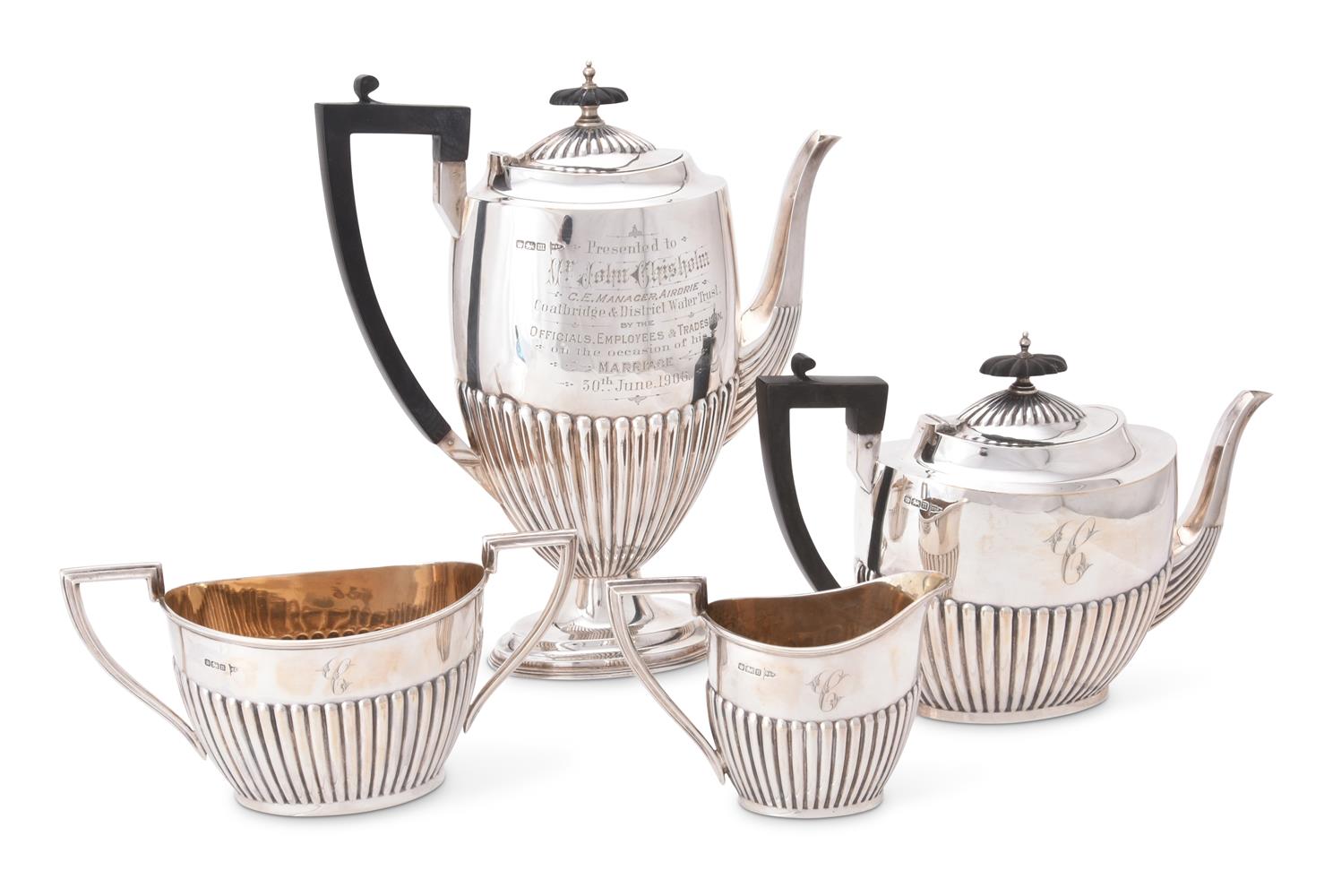 AN EDWARDIAN SILVER OVAL HALF REEDED FOUR PIECE TEA AND COFFEE SERVICE BY WALKER AND HALL