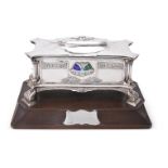 AN ARTS AND CRAFTS SILVER AND ENAMEL SHAPED RECTANGULAR FREEDOM CASKET