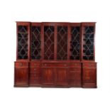 A GEORGE III MAHOGANY TRIPLE BREAKFRONT LIBRARY BOOKCASE