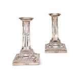 A PAIR OF LATE VICTORIAN SILVER COLUMNAR CANDLESTICKS BY THOMAS BRADBURY & SONS