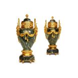A PAIR OF VERDE ANTICO MARBLE AND GILT METAL MOUNTED URNS