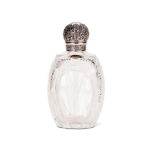 A VICTORIAN SILVER LIDDED CUT GLASS EAU DE COLOGNE BOTTLE