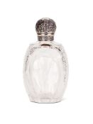 A VICTORIAN SILVER LIDDED CUT GLASS EAU DE COLOGNE BOTTLE