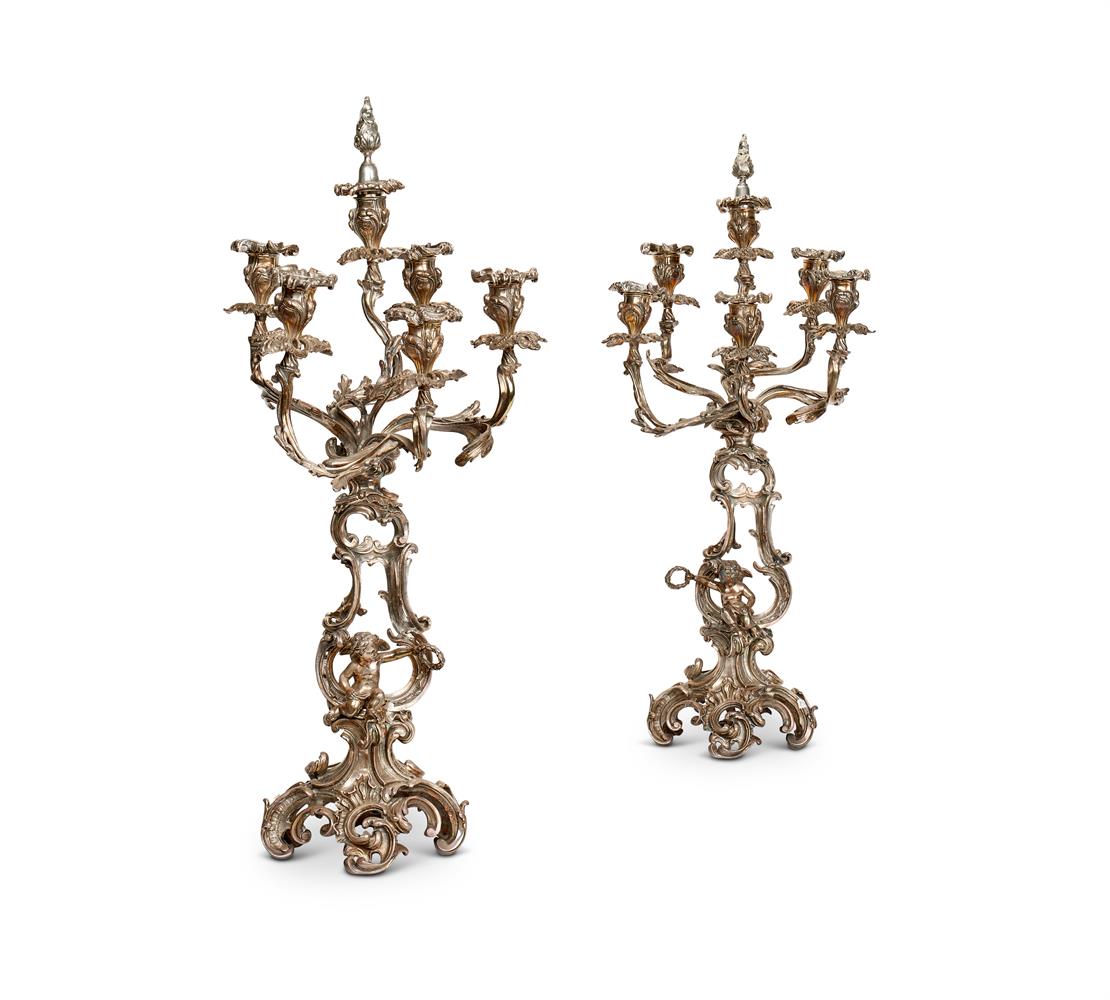 A PAIR OF SILVERED SIX BRANCH CANDELABRA