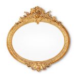 A LARGE ITALIAN CARVED GILTWOOD OVAL WALL MIRROR