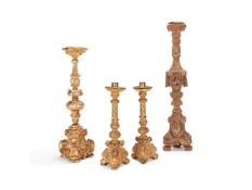 A PAIR OF CARVED GILT WOOD ALTAR CANDLESTICKS