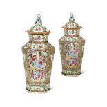 A PAIR OF CHINESE CANTON FAMILLE-ROSE TAPERING HEXAGONAL SECTION VASES AND COVERS