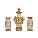 A CHINESE PORCELAIN AND FRENCH GILT METAL MOUNTED CLOCK GARNITURE