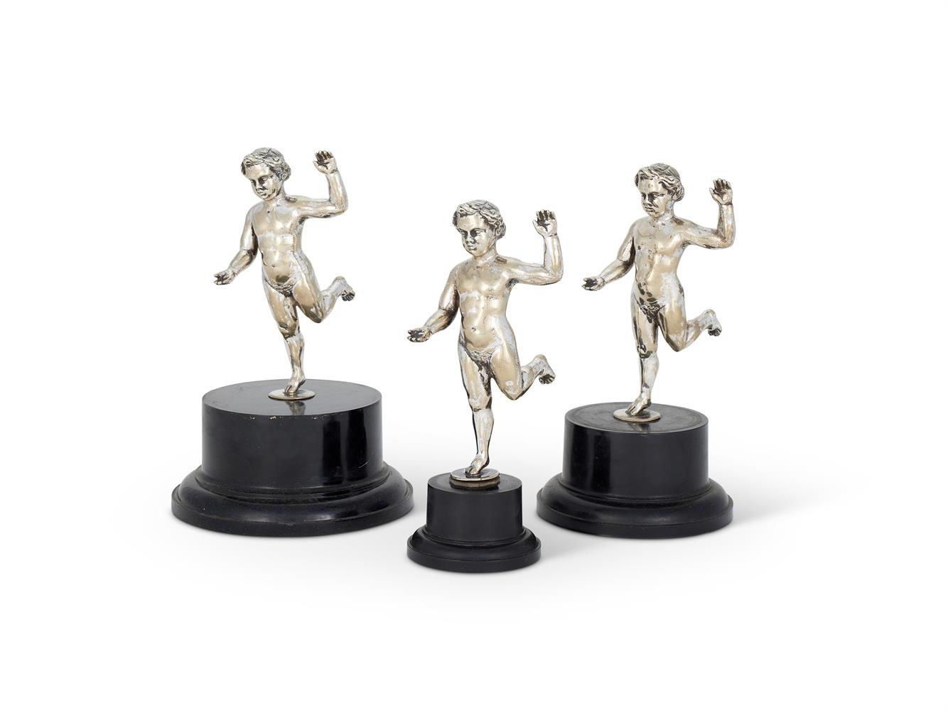 A SET OF THREE VICTORIAN ELECTRO-PLATED MODELS OF PUTTI RUNNING