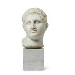 A SCULPTED WHITE MARBLE ROMAN HEAD