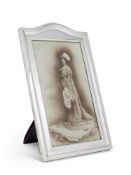 A LARGE SILVER ARCH TOP RECTANGULAR PHOTOGRAPH FRAME