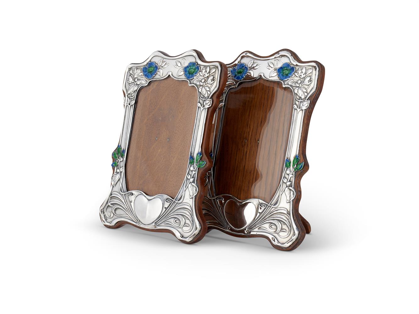 A PAIR OF ARTS AND CRAFTS SILVER PHOTOGRAPH FRAMES BY HENRY MATTHEWS