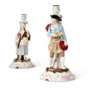 A PAIR OF CONTINENTAL PORCELAIN CANDLESTICK FIGURES