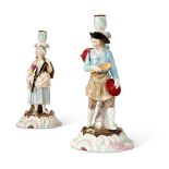 A PAIR OF CONTINENTAL PORCELAIN CANDLESTICK FIGURES