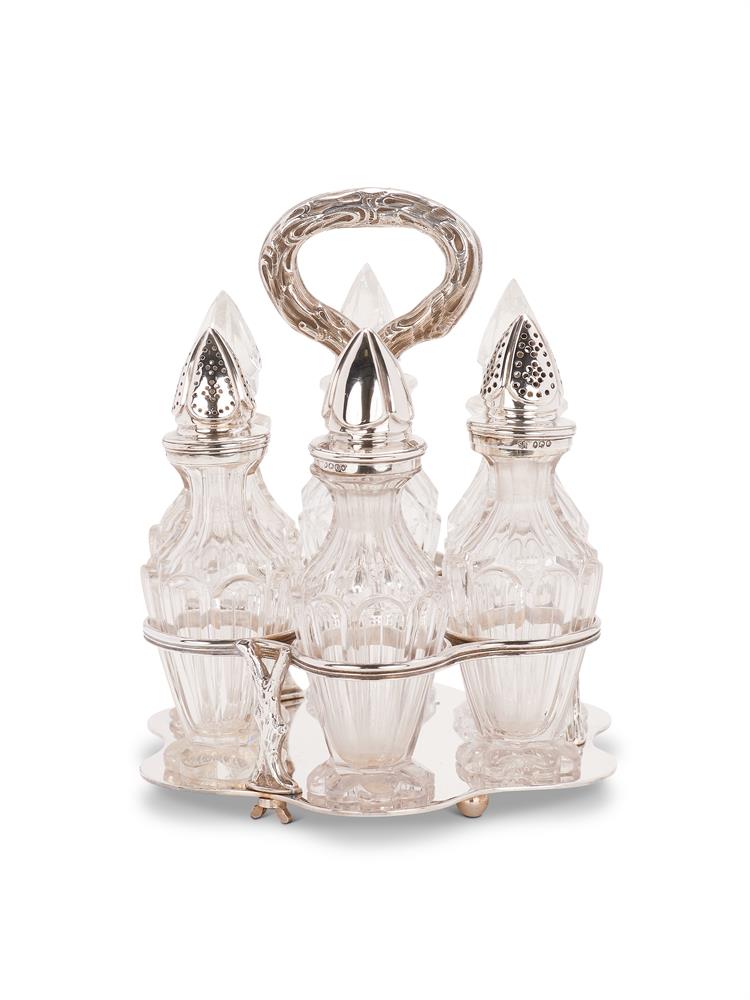 A SILVER HEXAFOIL SIX BOTTLE CRUET STAND