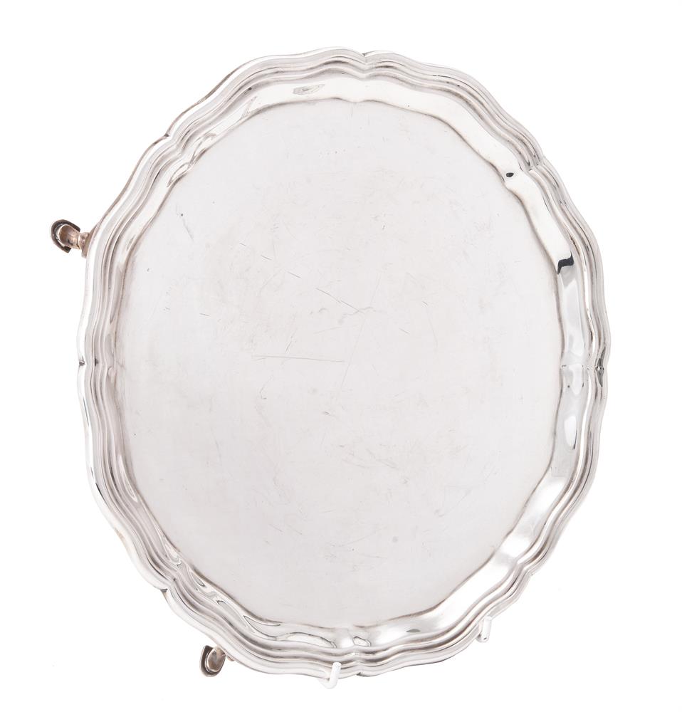 A silver shaped circular salver by Charles Stuart Harris