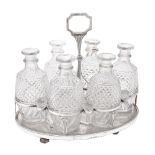 Y A cased George III silver mounted oval six bottle decanter stand