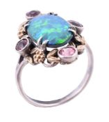 An Arts and Crafts opal doublet and pink tourmaline dress ring in the manner of Bernard Instone