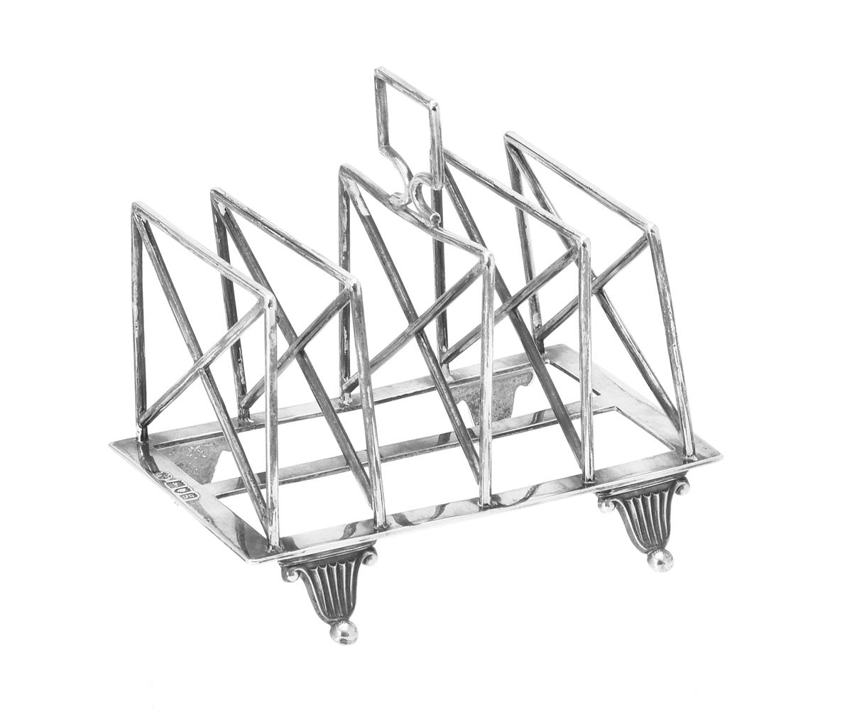 An Edwardian silver four division toast rack by William Hutton & Sons