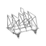 An Edwardian silver four division toast rack by William Hutton & Sons