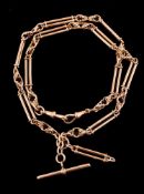 An Edwardian 18 carat gold fancy link Albert chain