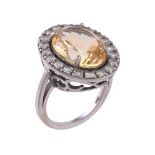 A diamond and citrine cluster dress ring