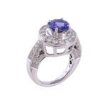 A diamond and tanzanite cluster dress ring