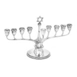 A silver nine branch Menorah by Adie Bros. Ltd.