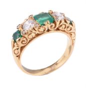 An emerald and diamond five stone ring